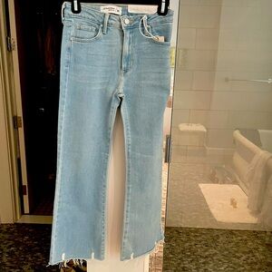 These Just Black denim jeans are in a Size 25. They are light blue denim